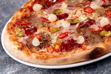 fresh pizza on the white plate