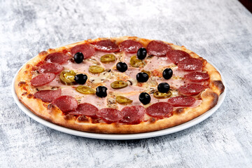 fresh pizza on the white plate