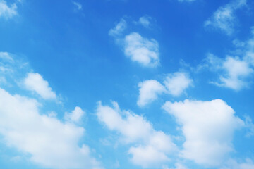 Fluffy Pure White Clouds Spreading across Vibrant Blue Sky