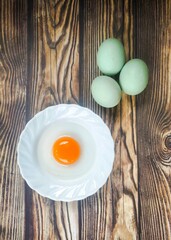 Duck eggs on a wooden table