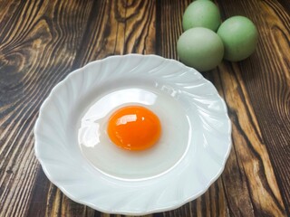 Duck eggs on a wooden table