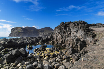 The Capelinhos volcano on Faial Island, the Azores, Portugal. Volcanic complex of Capelo. Caldera of Caldeira Volcano. Atlantic ocean coast. IUGS geological heritage site. - obrazy, fototapety, plakaty