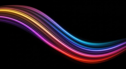 Obraz premium Abstract Swirling Lights: An abstract composition of vibrant, flowing lines in a kaleidoscope of colors against a black background. This dynamic image evokes energy, motion, and a sense of wonder. 