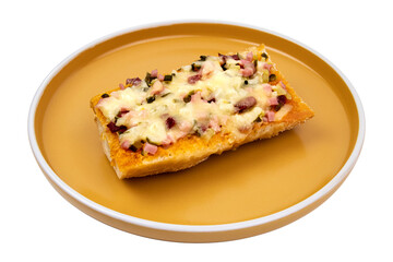 Delicious slice of toasted bread topped with cheese, ham, and peppers served on a yellow plate in a bright setting