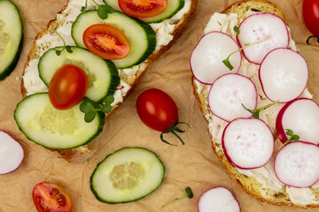 Fresh vegetable toast served on a rustic background with vibrant toppings and earthy textures at a cozy kitchen setting