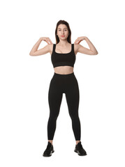 Woman in sportswear exercising on white background