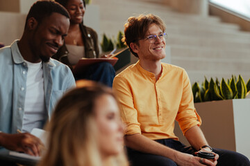 Students listening attentively to lecture in university classroom