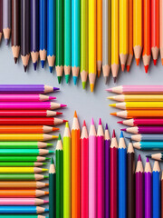 Obraz premium Colorful arrangement of various colored pencils on a light background