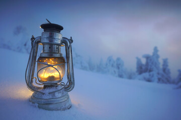 magic lantern in winter landscape on the mountain peak - oil lamp © Jenny Sturm