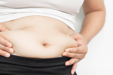 Closeup of abdominal surface woman fat, healthy care and beauty concept