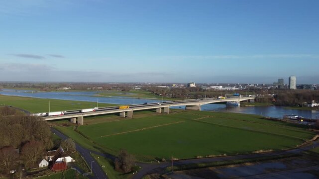 Zwolle, the Netherlands - January 8th 2025: Still aerial footage of the A28 or E232 highway bridge crossing the river IJssel into Overijssels capital Zwolle.