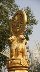 Golden Ashoka Chakra symbolizing dharma and unity
