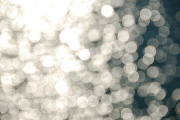 light shining on sea water blurry reflections on sunny day abstract background