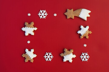 Christmas border with gingerbread cookies and white snowflakes, copy space for text