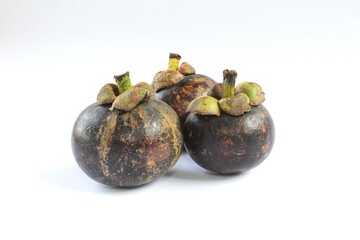 Mangosteen or Garcinia mangostana on a white background