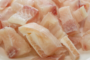 Pangasius fish fillet by pieces. Fresh fish fillet.