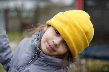 street portrait of a little girl, expressive eyes, natural beauty