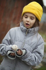 street portrait of a little girl, expressive eyes, natural beauty