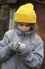 street portrait of a little girl, expressive eyes, natural beauty