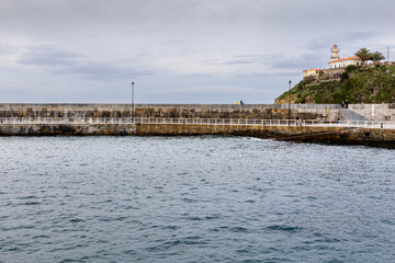 Obraz premium Fishing port and lighthouse of Cudillero, Asturias, Spain.