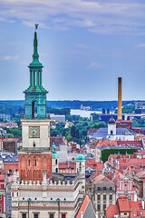 Naklejka premium City skyline rooftops and spires of churches of the historical Old Town of Poznan as seen from the high vantage point of the Old city hall bell tower, Poznan, Europe, Poland
