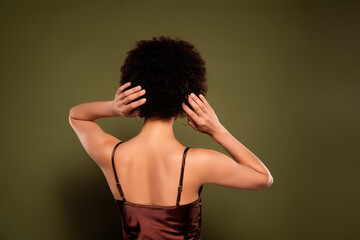 Obraz premium Photo of gorgeous pretty charming lady curly hairstyle isolated on khaki color background
