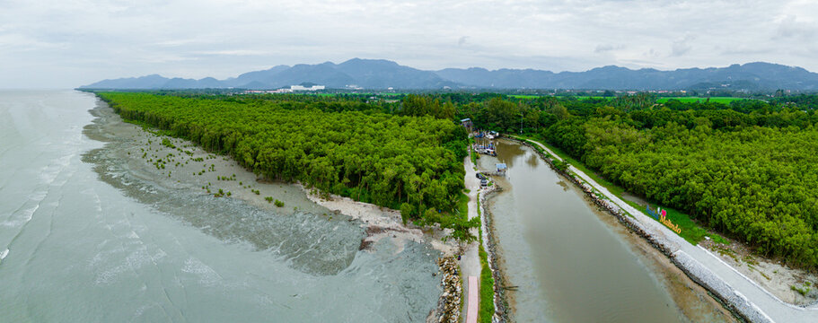 Aerial drone view of calm river estuary by the coast scenery at Pantai Malindo, Balik Pulau, Pulau Pinang, Malaysia.