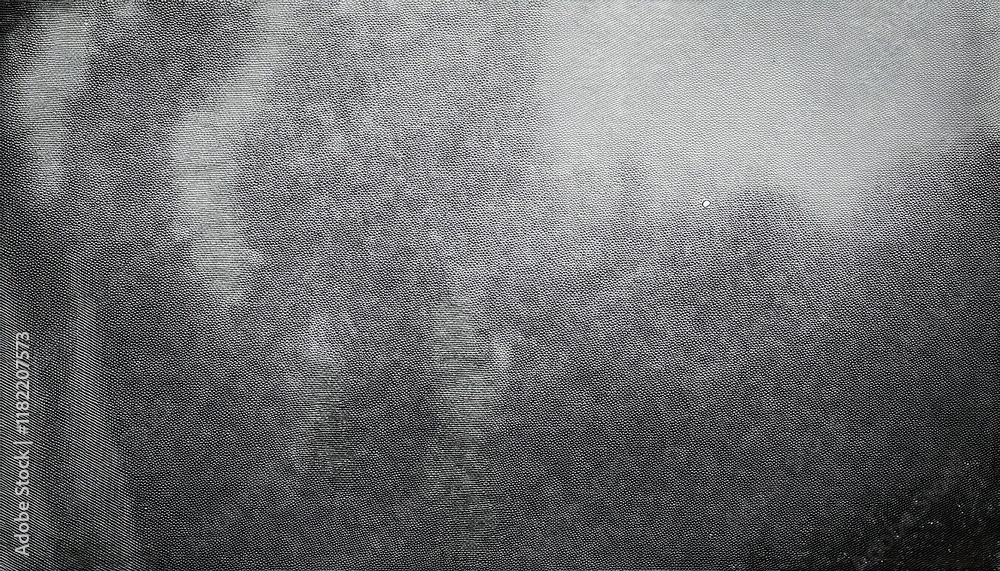 Poster textured grayscale surface with abstract blurred tree silhouettes creating a subtle moody background for artistic or design projects