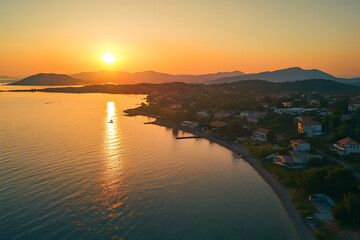 Beautiful sunset over the sea with an orange sky and sun, a summer landscape
