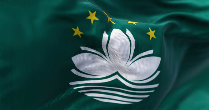 Close-up of Macau flags waving in the wind - Powered by Adobe
