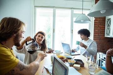 Group of young people studying together in modern home