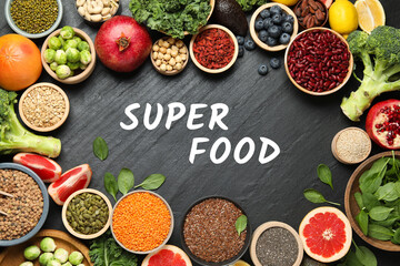 Superfood. Different healthy food products on grey table, flat lay