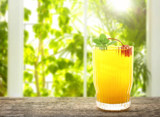 Tasty pineapple cocktail in glass on wooden table indoors. Space for text