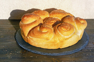 Balkan cuisine. Pogaca ( pogacha ), traditional Balkan bread, on rustic table