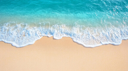 Aerial panorama of a beach with blue water, white foam, and sand, captured from a top-down perspective by a drone shot, showcasing the sea and waves in a flat lay composition.