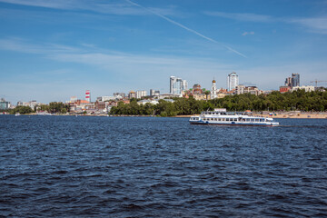 Fototapeta premium Volga river in the city of Samara, Russia. Panoramic view, a ship with tourists
