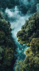 Serene river flows through lush green forest amidst misty mountains in the early morning light creating a tranquil natural landscape