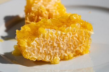 Thick honey melting from the honeycomb