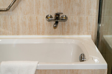 Clean bathroom modern bath. Hotel bathtub