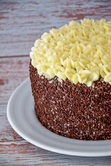 carrot cake with chocolate icing and white buttercream. homemade carrot cake detail