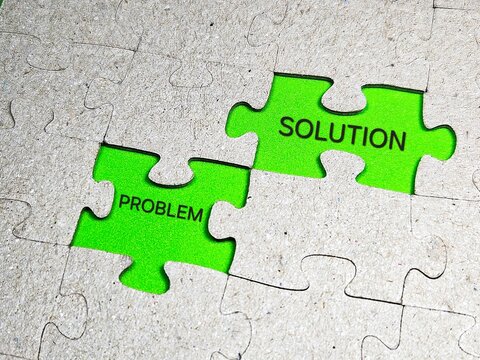 Management concept with puzzle piece with problem solving and solution stock photo