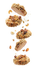 Yummy nut cookies in air on white background
