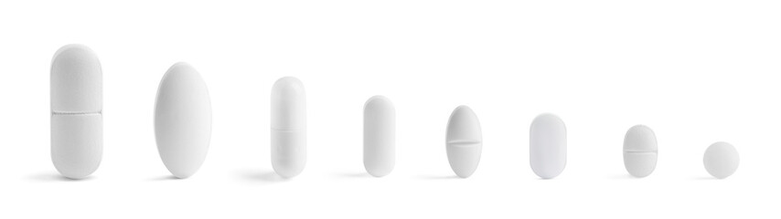 Different pills in row isolated on white, set