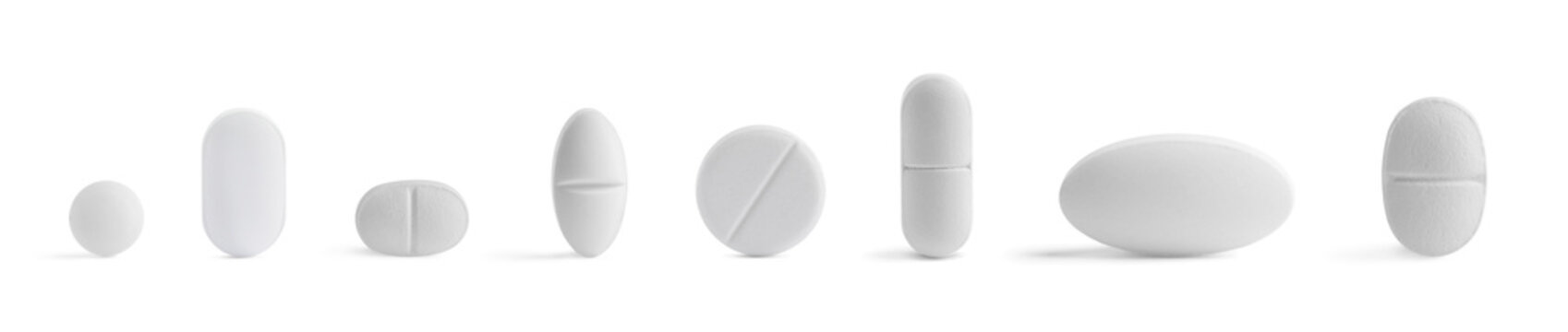 Different pills in row isolated on white, set