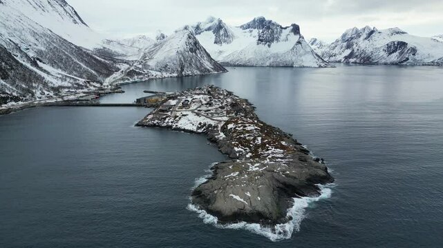 Husoy, a fishing village in Norway, aerial footage during the winter season