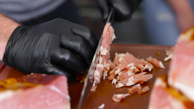Chef slicing smoked pork meat