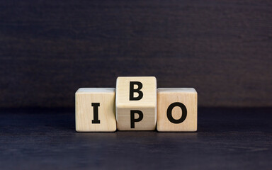Initial public or bond offering symbol. Concept words abbreviation IPO or IBO on wooden block....