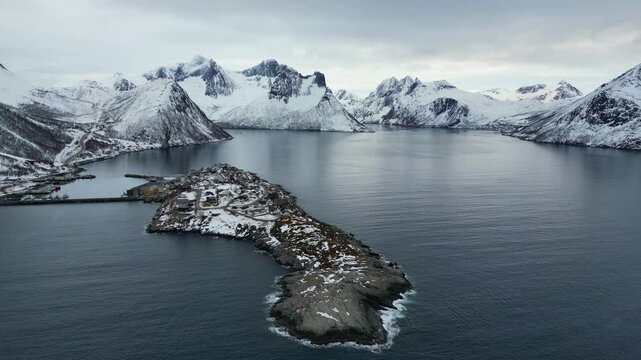 Aerial footage of the fishing village of Husoy in Norway, the entire island