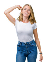 Fototapeta premium Beautiful young woman wearing casual white t-shirt over isolated background Dancing happy and cheerful, smiling moving casual and confident listening to music