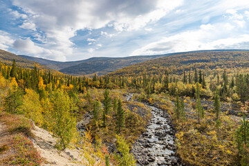 View to Mannepakhp river at Khibiny mountains. Early autumn in arctic tundra region. Kola peninsula, Murmansk region, Russia.